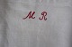 Eine alte Tüte für das Aufbewaren der Wäsche, aus 
Flachs gemacht
Die alte Tüte ist handbrodiert mit roten 
Initialen "MR"
65cm x 37cm
In sehr gutem Stande
