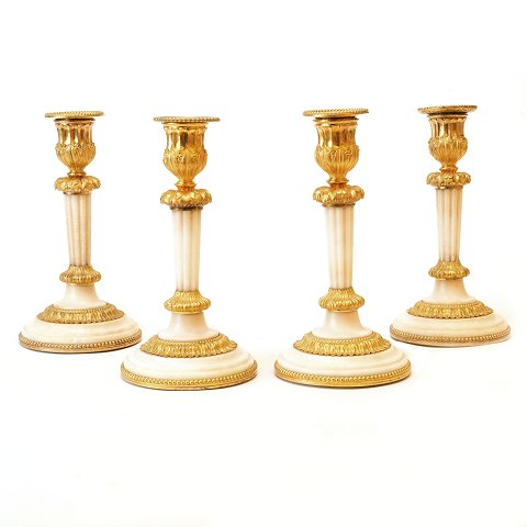 Set of four candle holders, marble and bronze
France around 1810