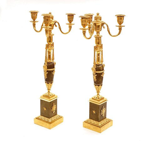 A pair of fire gilt bronze candelabra. France 
circa 1810. H: 48cm