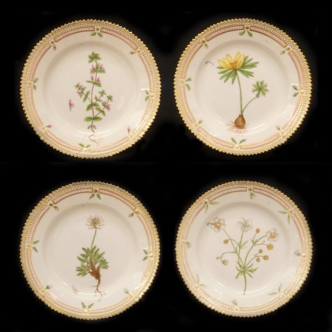 A set of four small Royal Copenhagen Flora Danica 
plates. #20/3551. D: 17cm