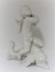 Bing & Grøndahl. Porcelænsfigur. Kai Nielsen. Havbarn på delfin, blanc de chine. 
Højde 20 cm. (1 sortering)