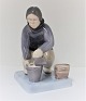 Bing & Grondahl. Porcelain figure. Greenlandic woman with bucket. Model 2416. 
Height 20.5 cm. (2. quality)