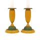 A pair of green and yellow decorated pair of candle sticks. Denmark circa 
1840-50. H: 19cm