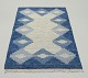 L'Art presents: 
Swedish 
textile 
designer.
Handwoven 
carpet in pure 
wool. Rölakan 
technique.