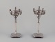 L'Art presents: 
A pair of 
large and 
impressive 
Italian 
candlesticks in 
silver.