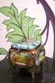 K&Co. presents: 
Antique 
French jewelry 
box in bronze 
with faceted 
glass and silk 
cushion at the 
bottom...