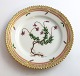 Lundin Antique 
präsentiert: 
Royal 
Copenhagen 
Flora Danica. 
Kuchenteller. 
Entwurf # 3552. 
Durchmesser 14 
cm. (1 ...