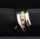 Lundin Antique 
präsentiert: 
George 
Jensen. Magic 
Ring Weiß- & 
Rotgold 18K mit 
5 Brillanten 
(750). 
Ringgröße 55. 
...