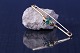Antik Huset 
presents: 
Unique 
gold brooch in 
14 karat gold, 
with a 
beautiful green 
stone. Stamped 
VW 585
