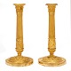 Aabenraa 
Antikvitetshandel 
præsenterer: 
Et par 
lueforgyldte 
Empire bronze 
stager. 
Frankrig ca. år 
1810. H: 28cm
