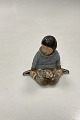 Danam Antik presents: Royal Copenhagen Overglaze Figurine - Boy with Flowers from Greenland No. 12419