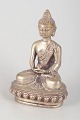 Silver-plated metal Buddha figure.