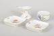 Meissen, candlestick, small bowl and two small dishes.