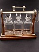 Middelfart Antik presents: English tantalus with 3 carafes
