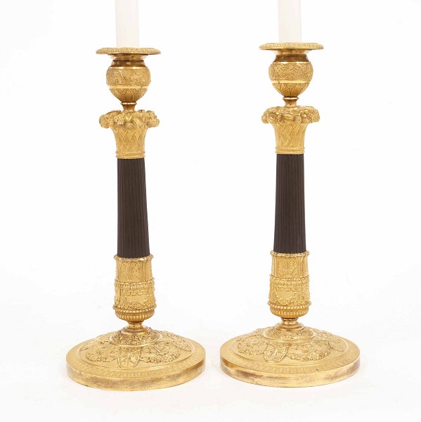 A pair of early 19th century gilt bronze candlesticks. France circa 1800. H: 
33cm