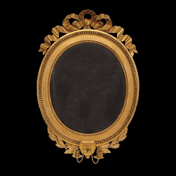 An oval early 19th century late Gustavian gilt mirror. Sweden circa 1800. Size: 
81x55cm