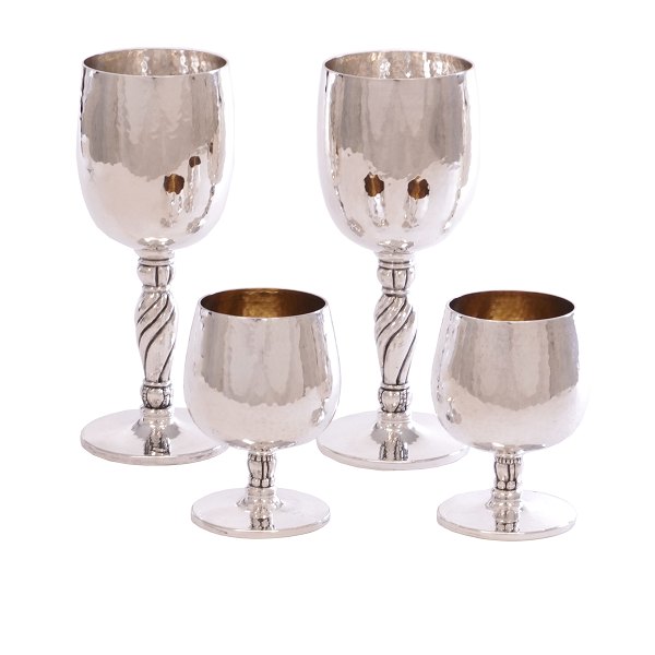 Set of four sterlingsilver cups made by Holmsted, Denmark. H: 18 & 9cm. W: 
1.068gr